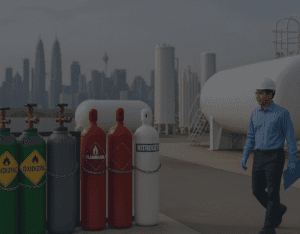 A high-resolution photo showing a modern Malaysian industrial gas facility with large storage tanks, pipelines, and workers in safety gear — representing the growth and opportunities in Malaysia’s industrial gas industry from 2025 to 2030.